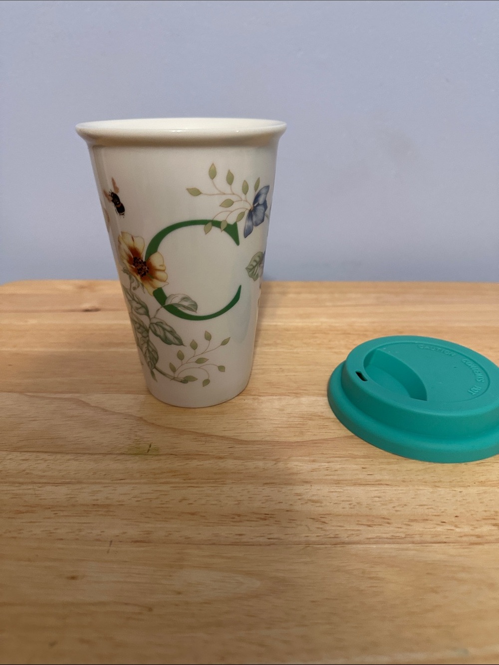 Ceramic Travel Mug with Floral 'C' Monogram and Teal Silicone Lid
